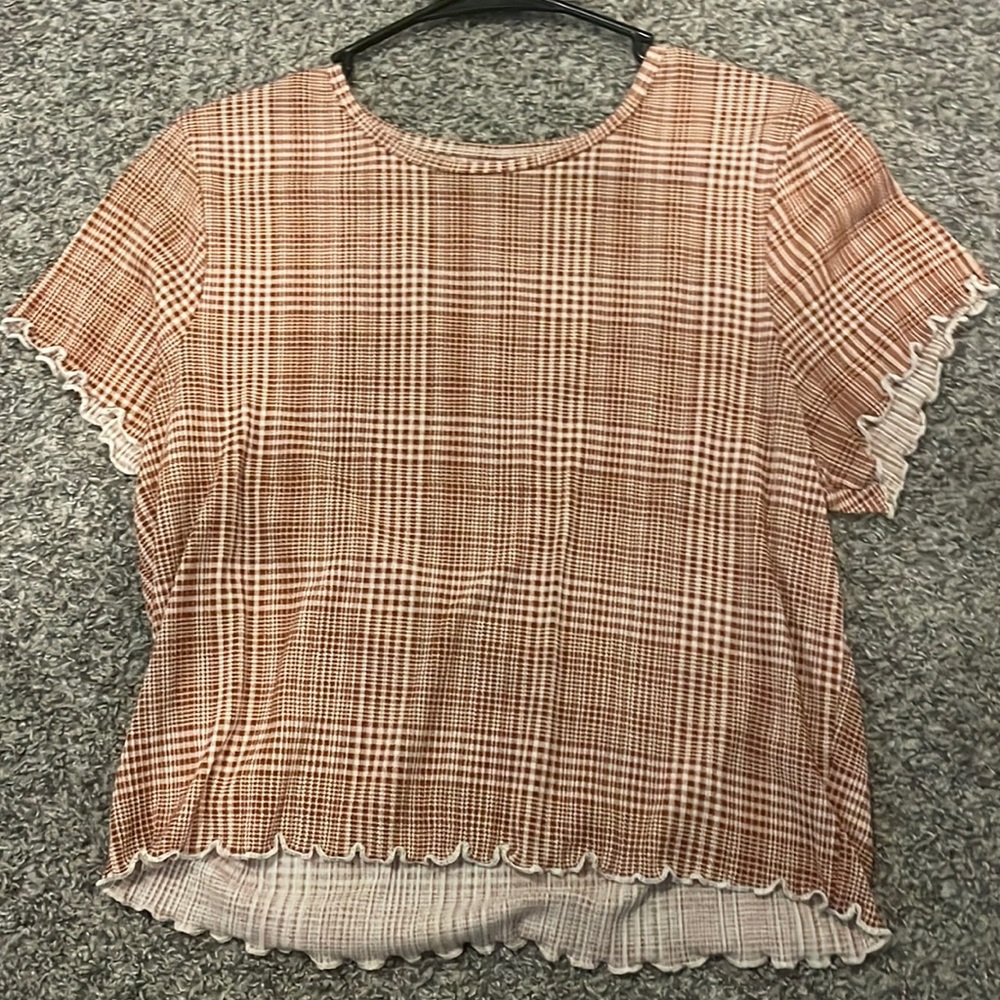 This is an American Eagle plaid-lettuce trimmed crop-top. Size extra large.